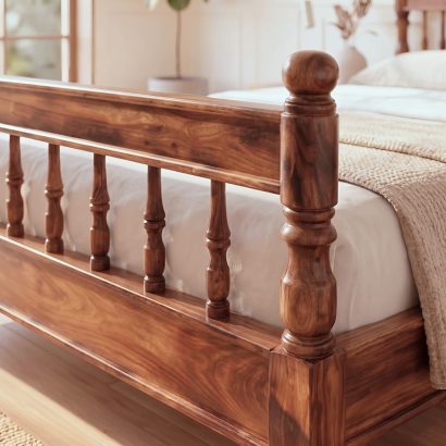 Premium carved wooden bed online made from solid Sheesham wood with an elegant carved headboard and classic spindle design.