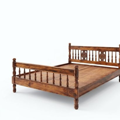 Premium carved wooden bed online made from solid Sheesham wood with an elegant carved headboard and classic spindle design.