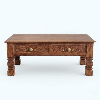 Elegant carved coffee table with drawers in modern interior