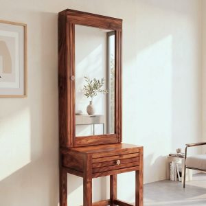Solid Sheesham wood dressing table with large rectangular mirror and storage drawer, placed in a modern minimalist bedroom with natural lighting.