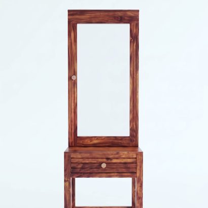 Solid Sheesham wood dressing table with large rectangular mirror and storage drawer, placed in a modern minimalist bedroom with natural lighting.