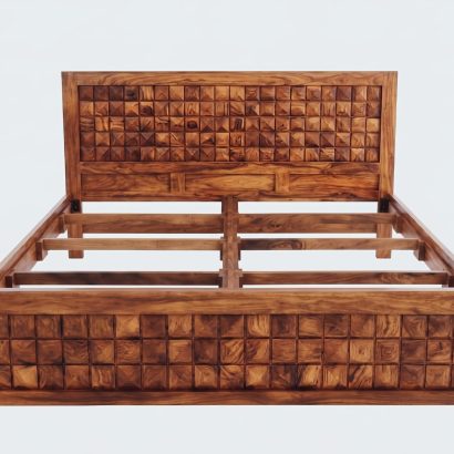 Solid Sheesham wood designer bed featuring a geometric carved headboard and footboard in a modern luxury bedroom