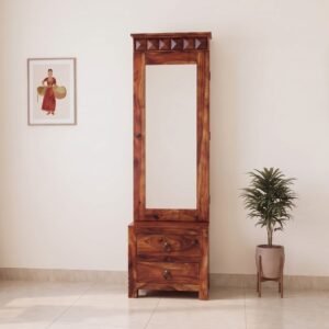 Traditional solid sheesham wood dressing table with full length mirror cabinet, carved diamond crown, and 2 bottom drawers in natural honey finish, placed in a well-lit bedroom